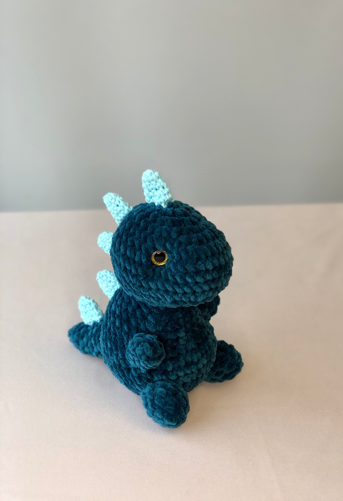 Crochet Plushy Rexy with glow-in-the-dark spikes